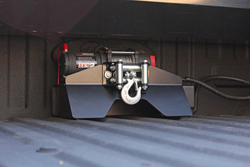 Short mounting plate for winch for pickup truck bed